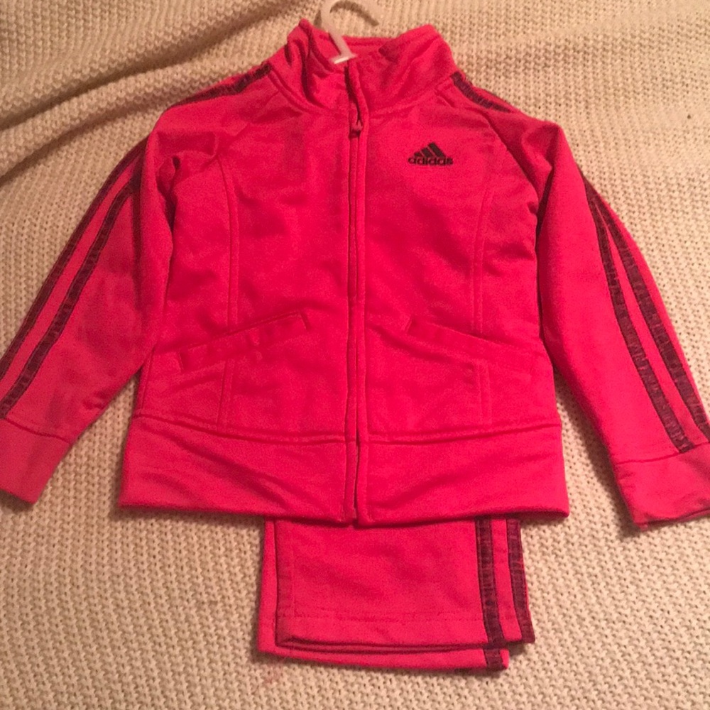 Bright pink adidas track suit